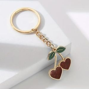 NWT keychain/charm 2 cute sparkly red cherries & stems dangle from a gold tone